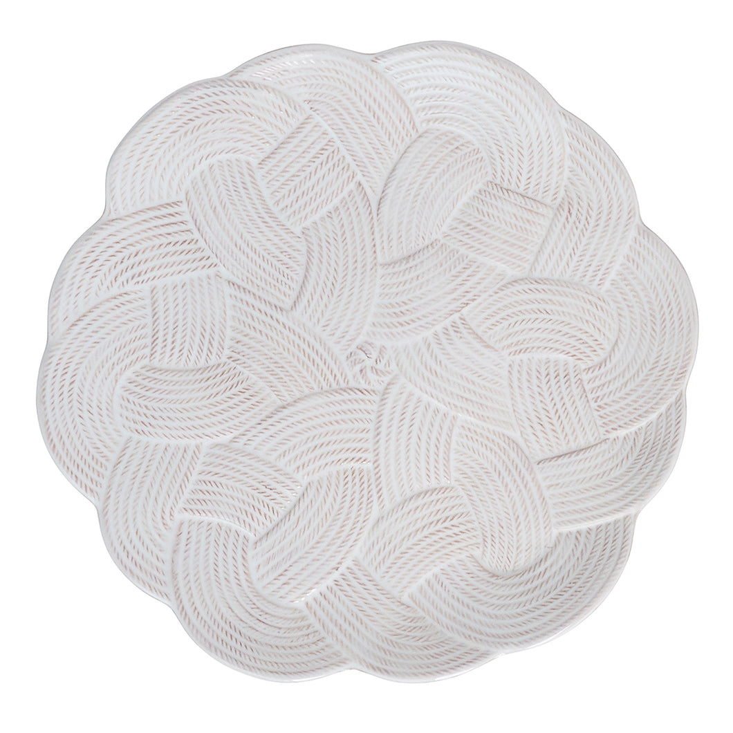 plate with rows of thread designs woven into an intricate knot