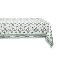 White table close with green floral design 