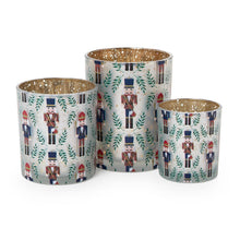 Load image into Gallery viewer, three sizes of Nutcracker Tealight Candleholders with. gold interior 
