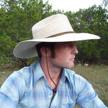 Load image into Gallery viewer, man wearing the tan hat with wide brim 
