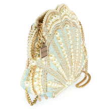 Load image into Gallery viewer, side show of the scalloped sea shell shaped hand bag heavily beaded with blue and gold beads and pearls
