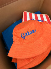 Load image into Gallery viewer, Jayne Terry Cloth Bucket Hat with gators in blue script 
