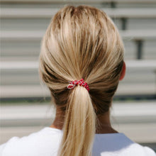 Load image into Gallery viewer, person with a red TELETIES Spiral Hair Coils small Go Noles! Hair Ties
