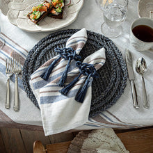 Load image into Gallery viewer, two Juliska Mystic Knot Napkin Ring on blue and brown striped napkins 

