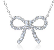 silver bow shaped pendant held by thin gold chain