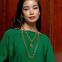 Load image into Gallery viewer, person wearing heavy gold chain with gold Capucine de Wulf Double Sided Pendant 
