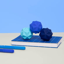 Load image into Gallery viewer, Odds Silicone Fidget Magnets on a desk
