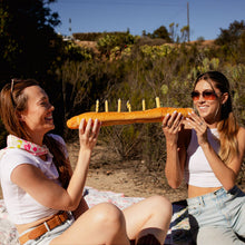 Load image into Gallery viewer, two people eating bread holding PASTA PARTY Noodle Candles
