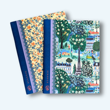 Load image into Gallery viewer, Pocket Notebook Duo - Paris Afternoon two notebooks with busy print covers one a Paris street scene the other a blue and pink floral pattern on a cream background
