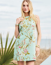 Load image into Gallery viewer, person wearing Mitzi Sheath Dress Seawall Botanical blue-green dress with floral pattern
