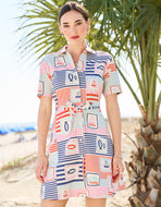 woman wearing a Spartina 449 Allison Shirt Dress with a navy blue, orange, pink and light blue pattern dress