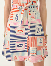 Load image into Gallery viewer, close up of tie waist and button up front of the skirt

