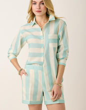 Load image into Gallery viewer, woman in Aida Buttonfront Shirt Admiral Stripe ling sleeve button up striped shirt and matching shorts
