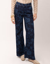 Load image into Gallery viewer, blue pants with a lighter blue floral print
