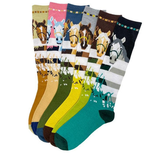 Colorful socks with an image of a horses looking over a white fence 