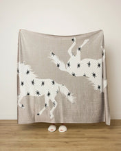 Load image into Gallery viewer, person holding the Geometry Unbound Butter Blanket 
