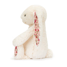 Load image into Gallery viewer, Jellycat Blossom Cream Bunny with strawberry floral pink fabric on its ears and feet side view showing tail
