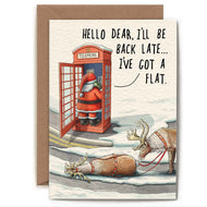 Greeting Card with image of Santa in a telephone booth, there are two reindeer next the the booth one is laying down on the ground, text reads Hello dear, I'll be back late... I've got a flat