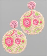 Load image into Gallery viewer, Pair of circular earrings with pink and green patterns on a gray background
