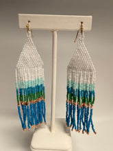 Load image into Gallery viewer, Decorative beaded fan with white, blue, green, and gold colors on a gray background

