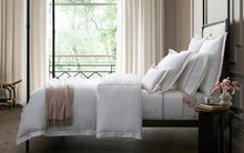 Load image into Gallery viewer, Matouk Amara Triple Pearl Bed Linen on a bed
