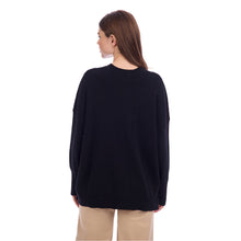 Load image into Gallery viewer, woman wearing a black sweater with long sleeves 

