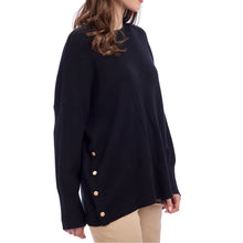 Load image into Gallery viewer, woman wearing a black sweater with long sleeves and button accents along the side
