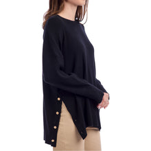Load image into Gallery viewer, woman wearing a black sweater with long sleeves and button accents along the side
