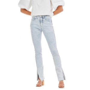 Woman in light blue jeans and a white shirt