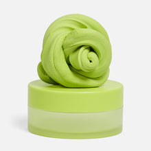 Load image into Gallery viewer, Speks Blur Calming Focus Putty in light green sitting on its storage container 
