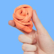 Load image into Gallery viewer, hand holding orange Speks Blur Calming Focus Putty
