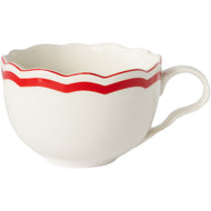 Cream mug with red along the scalloped edge 