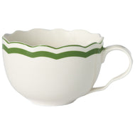 Cream mug with green along the scalloped edge 