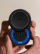 Load image into Gallery viewer, person putting a Havana Vanilla Capri Blue Pura Car Diffuser Refill in a diffuser 
