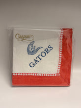 Load image into Gallery viewer, A packaged white paper napkin with a red border, featuring the word 'Gaspari' in gold script, a blue alligator logo, and the word 'GATORS' in blue. The napkin is sealed in clear plastic packaging against a neutral gray background.
