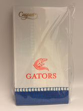 Load image into Gallery viewer, A Caspari Gators themed napkin set in clear plastic packaging, featuring a white napkin with a red gator logo and 'GATORS' text, and a blue patterned border.
