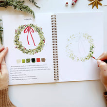 Load image into Gallery viewer, Christmas Watercolor Workbook painting a wreath 
