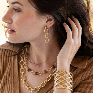woman  wearing gold jewelry