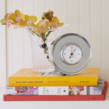 Load image into Gallery viewer, Mariposa Signature Round Clock on a stack of books next to a vase
