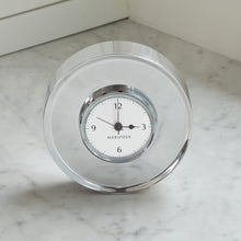 Load image into Gallery viewer, Mariposa Signature Round Clock white and black clock with 12, 3, 6, and 9  clock face surrounded by wide silver colored border 
