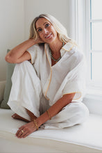 Load image into Gallery viewer, woman in the Hayley Linen Pants in white paired with a white top
