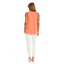 Load image into Gallery viewer, woman in an orange sleeveless shirt and white pants photographed from the back
