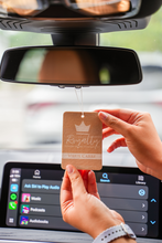 Load image into Gallery viewer, person holding an rectangle shaped air freshener that is hanging from a cars rear view mirror
