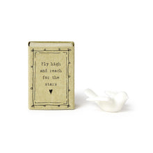 Load image into Gallery viewer, white ceramic dove next to tan box with simple line designs and the text Fly high and reach for the stars
