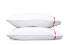 Load image into Gallery viewer, Two pillows with Matouk Essex pillowcases with two simple lines of embroidery in Hibiscus red/pink, one line a slightly lighter shade than the other
