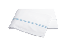 Load image into Gallery viewer, Matouk Essex flat sheet with two simple lines of embroidery in light blue, one line a slightly lighter shade than the other

