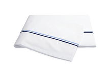Load image into Gallery viewer, Matouk Essex flat sheet with two simple lines of embroidery in Navy, one line a lighter shade than the other
