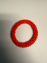 Load image into Gallery viewer, Red beaded bracelet on a light gray background
