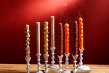 Load image into Gallery viewer, Four styles of candles in white candle holders
