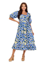 Load image into Gallery viewer, woman in long blue light yellow and white floral dress with puff sleeves
